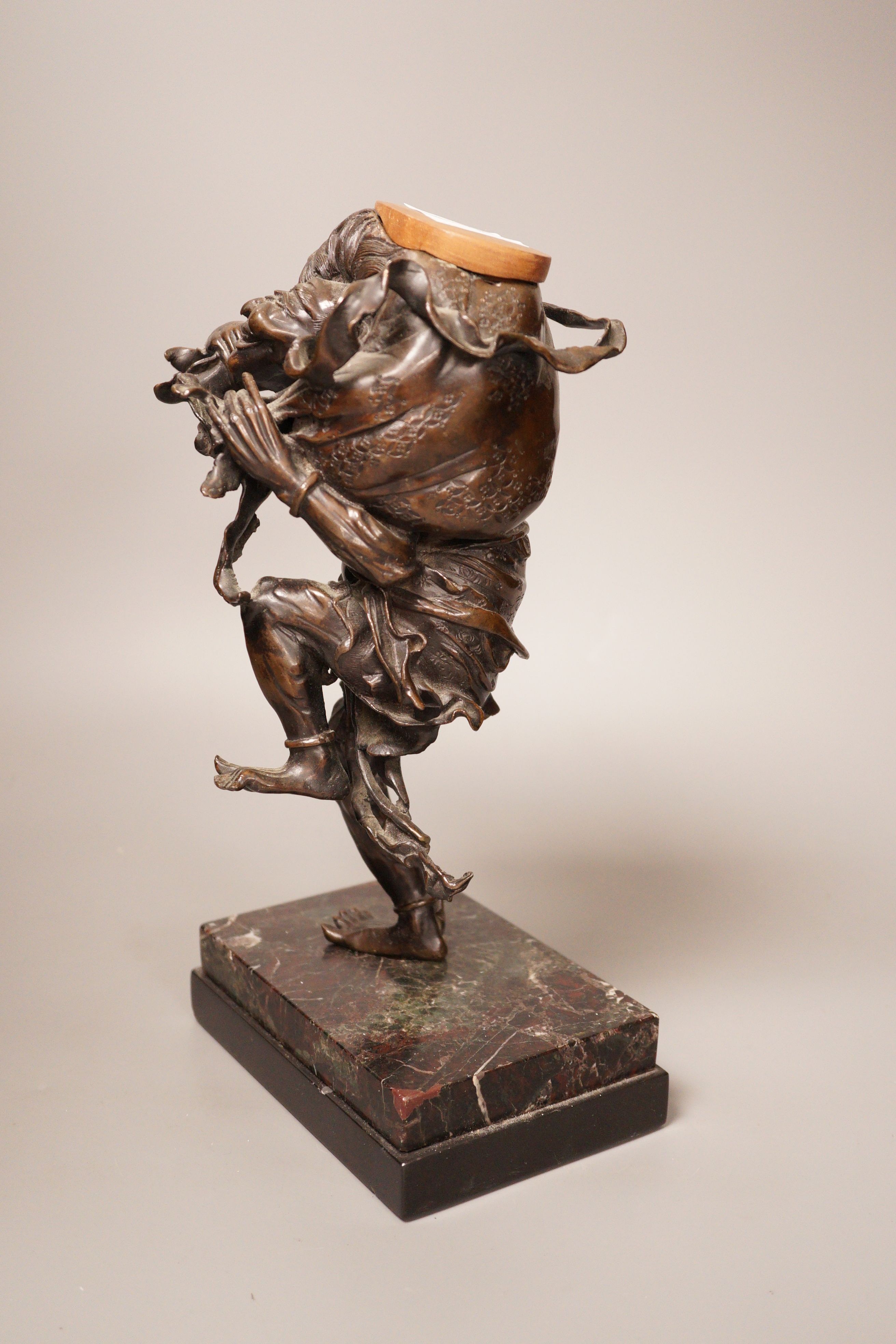 A Meiji period Japanese bronze figural censer, study of a demon, 31cm